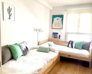 a living room with a couch with pillows on it at Casa Oso in Panticosa