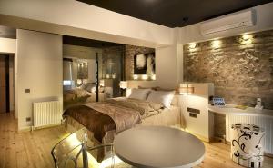 a bedroom with a bed and a table in it at Nuru Ziya Suites in Istanbul +37 photos