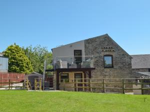 a house in the middle of a field at The Old Coach House in Hayscastle