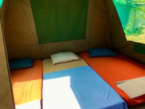 Postel nebo postele na pokoji v ubytování Corto Novo Maison d'hôtes-Camping