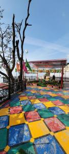 a colorful tile floor in front of a pavilion at Casa Arhan 2-3-4-7-12 BHK Luxury Penthouse in Mussoorie