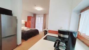 Posteľ alebo postele v izbe v ubytovaní Holiday Family