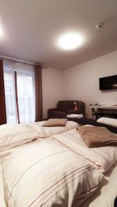 Posteľ alebo postele v izbe v ubytovaní Holiday Family