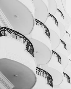 a spiral staircase in a building at Hotel Empire Albania in Durrës