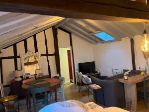 a living room with a couch and a table at Appartement dans le Vieux Mans in Le Mans