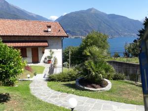 a house with a view of the water and mountains at Villa Emma in Cremia