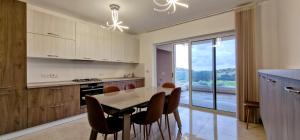 a kitchen with a table and chairs with a view at Valley View in Qrendi