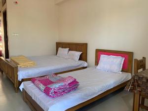 Ένα ή περισσότερα κρεβάτια σε δωμάτιο στο Hotel Grand Brothers
