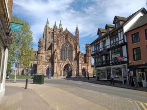 a large cathedral with a building in a city at No 8 in Kington