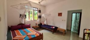 Voodi või voodid majutusasutuse Wimala B&B toas