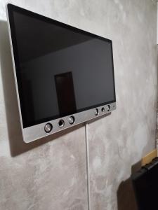a flat screen tv sitting on a wall at Salvatori 