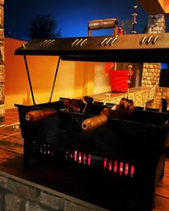 a grill with a bunch of hot dogs on it at Viva Villa in Jhājra