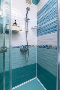 a bathroom with a shower with a blue at Dufti Home in Plovdiv Center & Old Town / Kapana in Plovdiv
