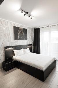 Katil atau katil-katil dalam bilik di Skylark - Milano Studio with Terrace and Panoramic View
