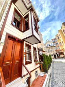 a house with a wooden door on a street at Authentic Turkish Home Family Room in Istanbul