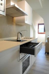 Kuchyň nebo kuchyňský kout v ubytování APARTAMENTOS TURÍSTICOS GUIANA + 37 fotografií