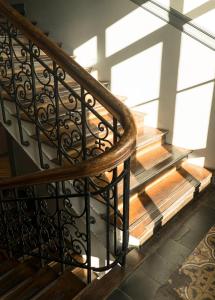 a spiral staircase in a building with wooden floors at Cochs Pensjonat in Oslo