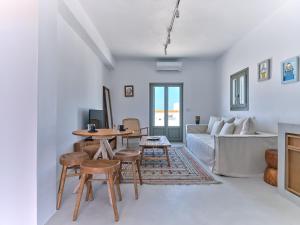 A bed or beds in a room at Siora of Paros - Ammiralis & Castelis