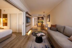 a living room with a couch and a table at Aria in Eilat