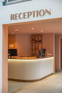 a reception counter in a hospital with a scientology sign at Hotel Halbert in Groningen