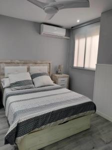 a bedroom with a large bed in a room at NAUTILUS in Torrevieja