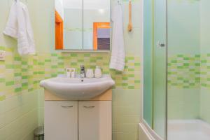 Koupelna v ubytování Beachfront apartment + 29 fotografií