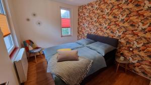 Postel nebo postele na pokoji v ubytování Ferienhaus Rehblick - direkt in der Natur, mit Lesezimmer und zwei Terrassen