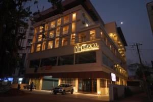 a large building with a sign on the front of it at Hotel Bekal International in Kāsaragod