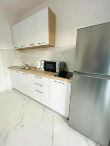 Kuchyňa alebo kuchynka v ubytovaní Spacious Apartment Amaros