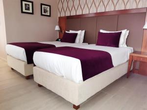 Xenon Hotel & SPA 객실 침대