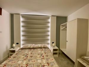 Postel nebo postele na pokoji v ubytování Hotel Sciatori 3 Stelle Superior