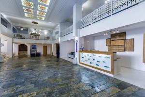an empty lobby with a stained glass ceiling at Amalia Hotel in Skopelos Town