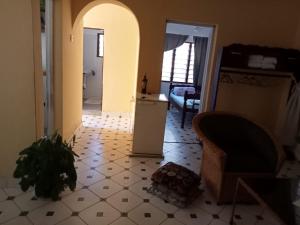 a living room with a refrigerator and a floor at Im Herzen afrikas in Mtwapa