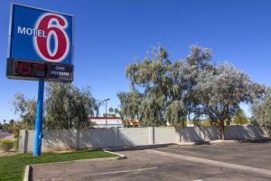 a mobil gas station sign in a parking lot at Motel 6 Mesa North in Mesa