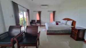 Postel nebo postele na pokoji v ubytování PawPaw Resort