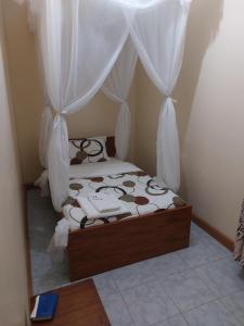 Postel nebo postele na pokoji v ubytování Roza Guest House