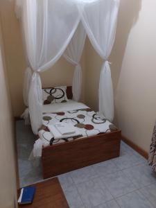 Postel nebo postele na pokoji v ubytování Roza Guest House