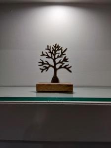 a small tree sitting on top of a shelf at Chalkida Hilltop Apartments in Chalkida