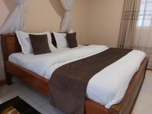 Postel nebo postele na pokoji v ubytování Roza Guest House