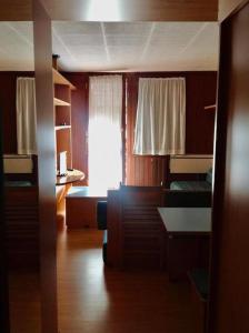 a room with two bunk beds and a window at La Finestra sul Cervino in Breuil-Cervinia