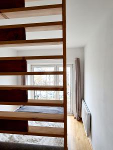 a bedroom with two bunk beds and a window at Open View City Apartment in Vienna