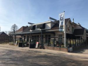 a building on the side of a street at Wapen van Exloo in Exloo