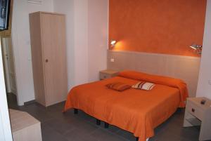 Postel nebo postele na pokoji v ubytování Hotel La Zorza