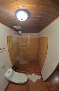 a bathroom with a toilet and a ceiling at Casa Jungle Monteverde B&B in Monteverde Costa Rica