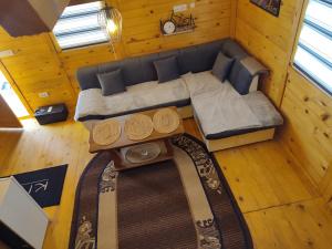 an overhead view of a couch and a table in a room at Vikendica Jankovic in Pale +2 photos