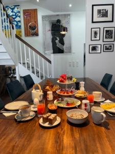 a table with plates of food on top of it at WineArtB&B 