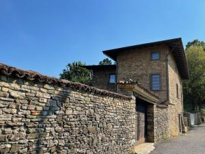 an old stone building with a stone wall at Foresteria Antica Bastia B&B in Bergamo