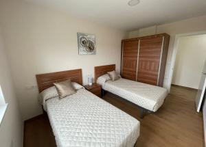 Postel nebo postele na pokoji v ubytování VISTAS A LA RIA