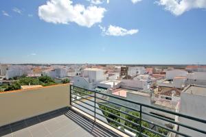 a balcony with a view of a city at Apartamento Oliveira in Santa Luzia