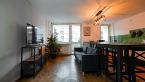 Televízia a/alebo spoločenská miestnosť v ubytovaní Wow Rooms
